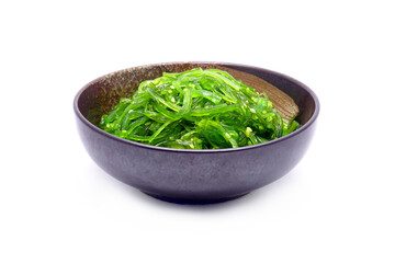 Wakame Salad in traditional Japanese ceramic bowl isolated on white background. Famous Japanese appetizer
