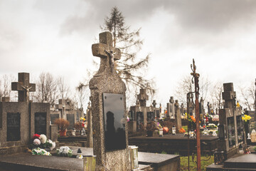 Gravestones on the cemetery.Clouds in background.High quality photo.