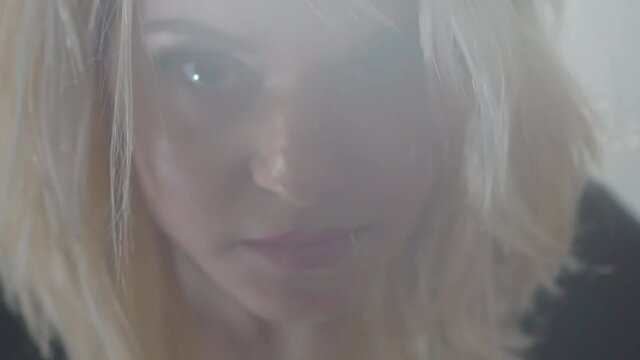 Slow Motion Closeup photo portrait of strict milf with short hairstyle