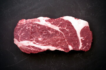 Raw Steak. Sirloin Raw Beef Steak, Overhead View. Single Raw Striploin Steak from Marbled Beef on...