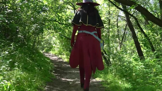 Slow Motion Beautiful young witch, halloween concept, evocation and nature magic