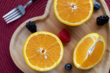 Fresh oranges, apple and blackberry
