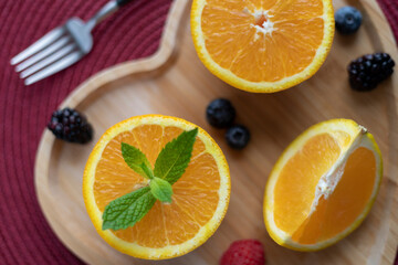 Fresh oranges, apple and blackberry