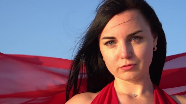 Slow Motion Portrait of brunette woman wearing elegant red gown