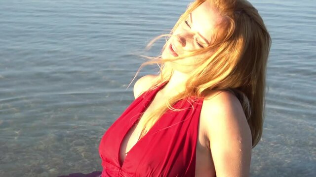 Slow Motion Woman in a Red on the Beach
