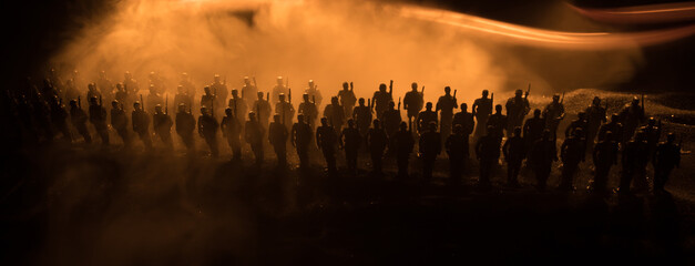 War Concept. Military silhouettes fighting scene on war fog sky background, World War Soldiers...