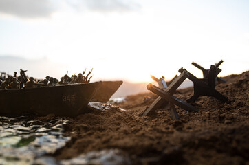 World War 2 reenactment (D-day). Creative decoration with toy soldiers, landing crafts and...