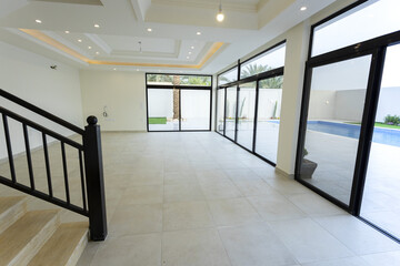 Room interior after renovation, unfurnished apartment with white walls and color pattern on the wall