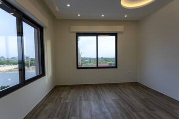 Room interior after renovation, unfurnished apartment with white walls and color pattern on the wall