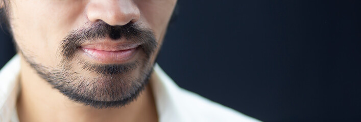 face of people with beautiful mustache and dark copy space background, Product serum mustache or...