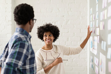 Two colleagues working in creative studio