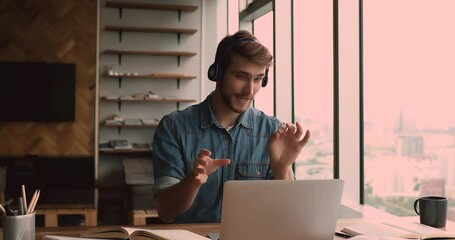 Millennial confident businessman lead business virtual meeting negotiating with company client use video call app and laptop. Student guy studying with schoolmate remotely by video conference concept