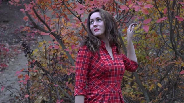 Slow Motion Woman breathing deep fresh air in a forest in autumn