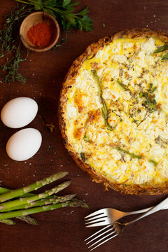 Quiche with ingredients of eggs, asparagus, paprika and thyme