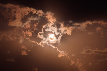 Obraz na płótnie Canvas Sun behind clouds