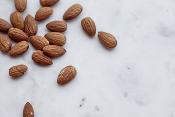 Almonds and white marble  tray