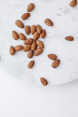 Almonds and white marble  tray