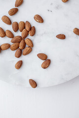Almonds and white marble  tray