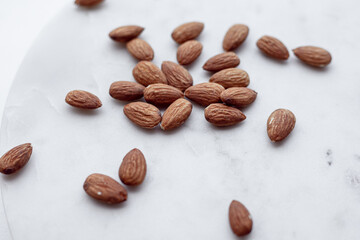 Almonds and white marble  tray