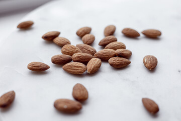 Almonds and white marble  tray