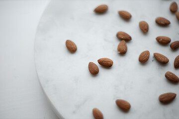 Almonds and white marble  tray