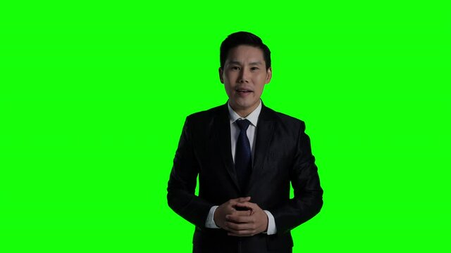 Business newscaster is reporting unusual circumstances and reporting economic news with isolate green screen background or chroma key.