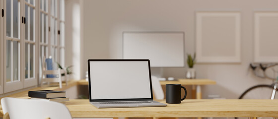 3D rendering, laptop with mock-up screen on wooden table beside the window in home office