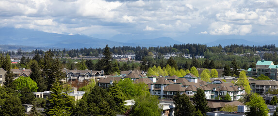Fototapeta na wymiar Aerial View of Residential Homes in a peaceful neighborhood on the West Coast. Sunny Spring Day. White Rock, Vancouver, British Columbia, Canada.