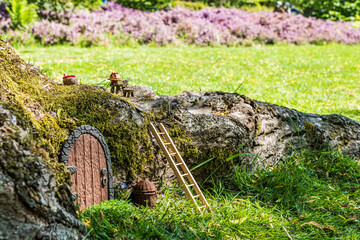 fairy house or elf home in a tree small door made of polymer clay and other miniatures