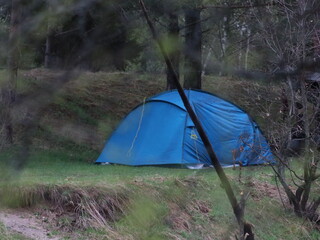 A tent in a grassy area