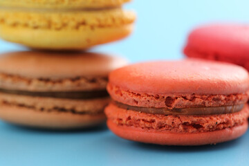 Colorful macarons isolated in blue background