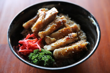 japanese food Chicken teriyaki with rice on wood background