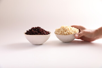 Organic boiled brown rice on bowl isolated in white background