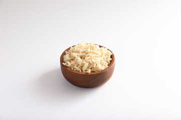 Organic boiled brown rice on bowl in close up