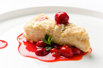 napoleon cake with cherry sauce and mint