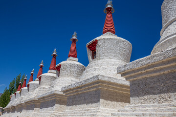 White buddhist stupa or pagoda in tibetan monastery near village Leh in ladakh, noth India
