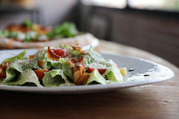 caesar salad appetizer on wooden background