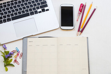 notebook planner, mobile phone, computer for business work arrangement falt lay style on background white