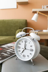 Alarm clock on table in room