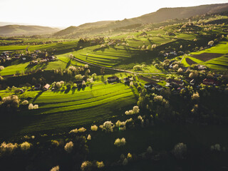 Spring landscape in Slovakia. Polana region, Hrinova. Green spring rural hills landscape, fields, flowering trees, organic farming © Zedspider