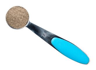 ground black pepper in measuring teaspoon cutout