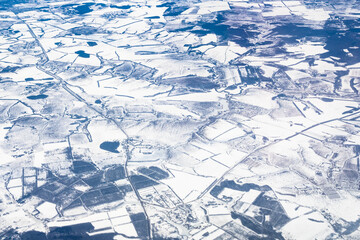 Fototapeta na wymiar aerial view of snow-covered fields in Russia