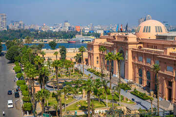 CAIRO, EGYPT - MAY 11, 2021 : Cairo Museum Of Egyptology And Antiquities. aerial view of Facade of the Egyptian Museum in Cairo and the Nile River - obrazy, fototapety, plakaty