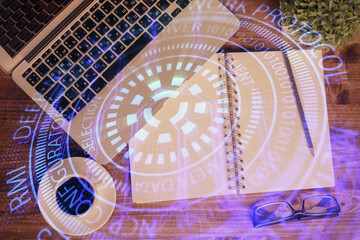 Multi exposure of data theme drawing hologram over topview work desk background with computer. Concept of technology.