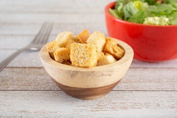 A closeup view of a small bowl of croutons.