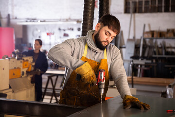 Factory worker with screwdriver. High quality photo