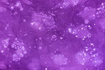 Purple wall with spots of paint. Decorative background.