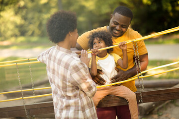  African American family having fun outdoors.