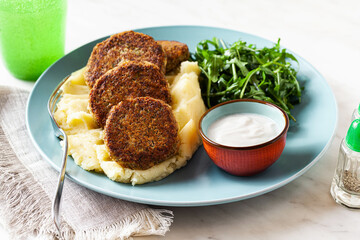 vegan lentil cutlets without meat with potatoes and salad. healthy eating