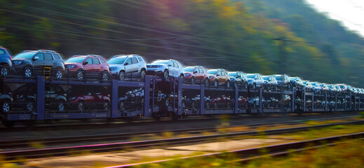Transport of cars on railway platforms. Car carrier. 